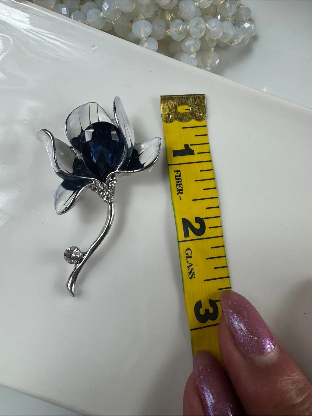 Silver Floral Brooch with Deep Blue Faceted Crystal